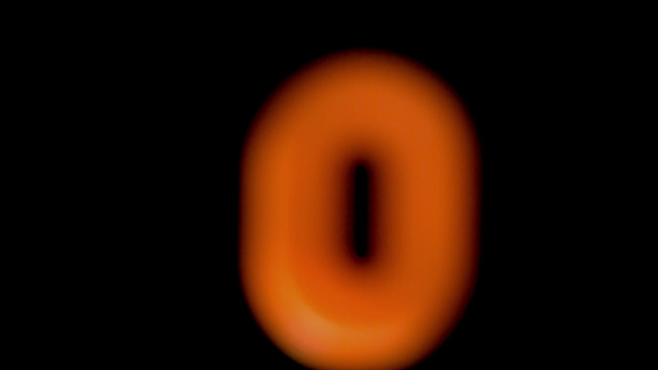 The number zero coming into focus on black background