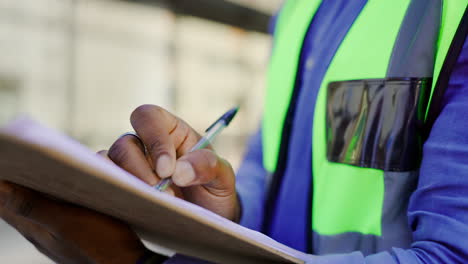 Checklist-and-man-hands,-construction-worker