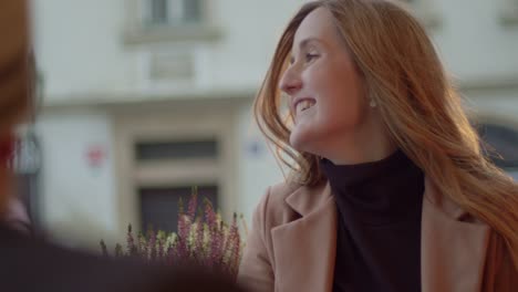 young caucasian woman smiling and enjoying date in prague, smiling closeup face view