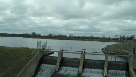 a rising aerial over a small hydroelectric dam