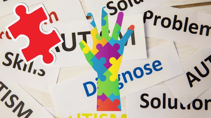 Animation of colourful puzzle pieces and autism awareness month text