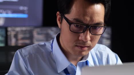 man working late night on computer