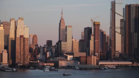 sunset color reflecting on the skyscrapers of midtown manhattan new york city