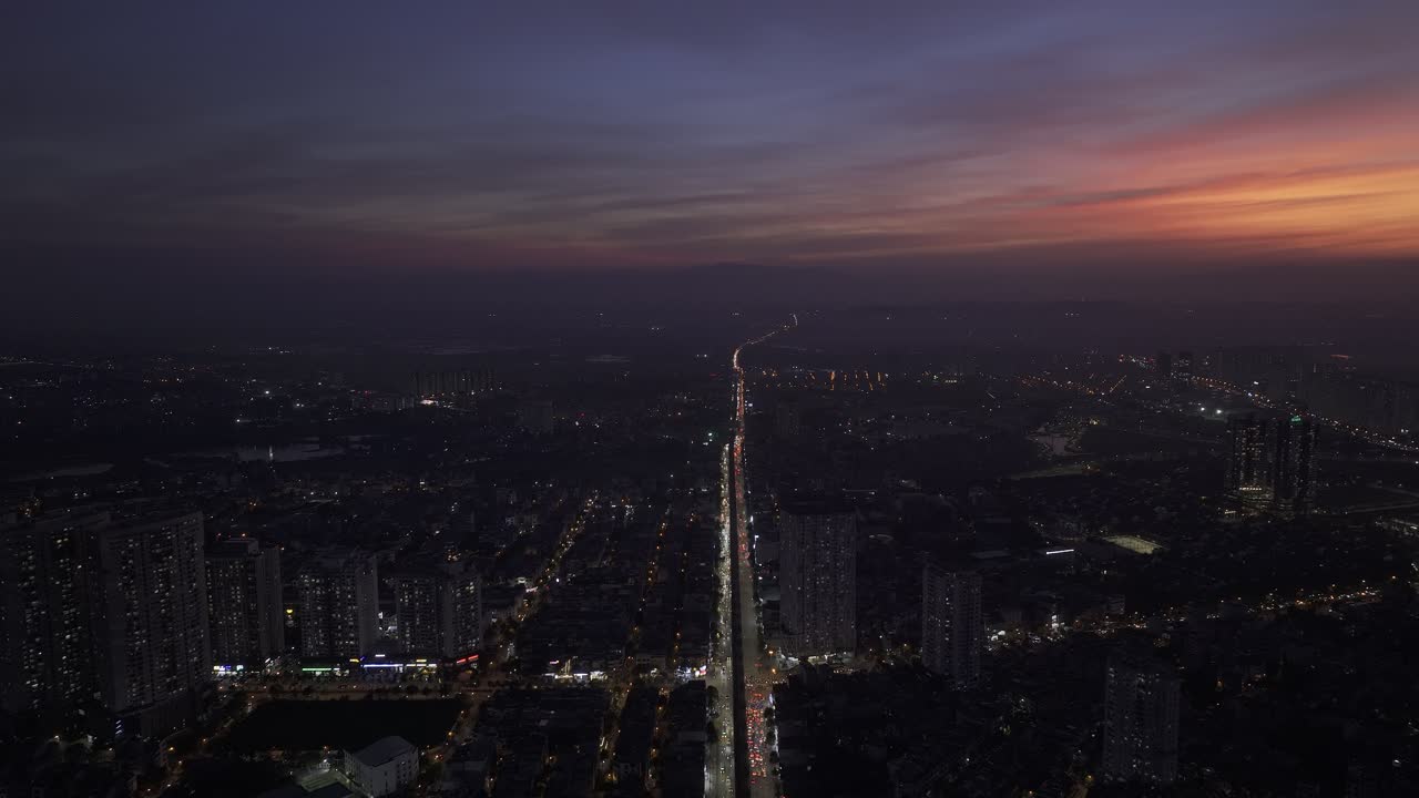 Aerial View of City at Night During Sunset