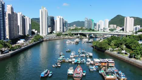 Aberdeen-harbour-and-skyline-in-southwest-Hong-Kong-island-on-a-beautiful-day,-Aerial-view