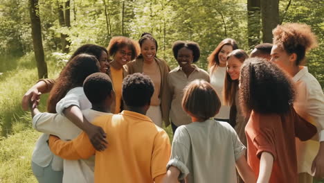 diverse group embracing in a nature setting