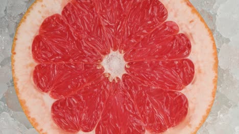 fresh pink grapefruit slice over crushed ice