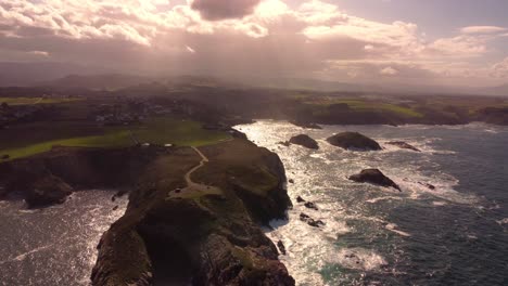 Aerial-sunset-view-stunning-natural-location-unpolluted-drone-fly-over-the-cliff-rock-formation-green-meadow-Galicia-region