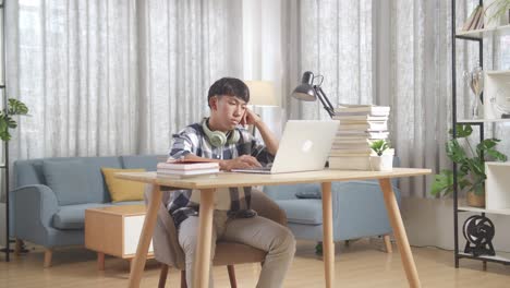 teenage boy studying at home