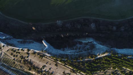 high-angle view of a valley with river and cliff