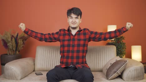 man making heart symbol for camera.