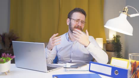 Home-office-worker-man-getting-bad-news-from-camera.