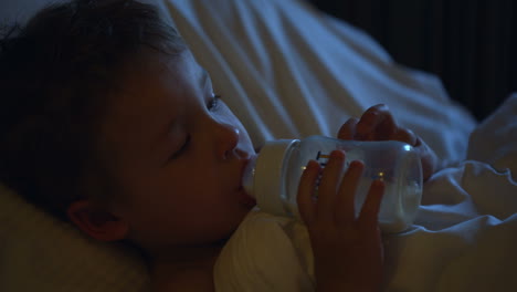 boy drinking milk before bedtime