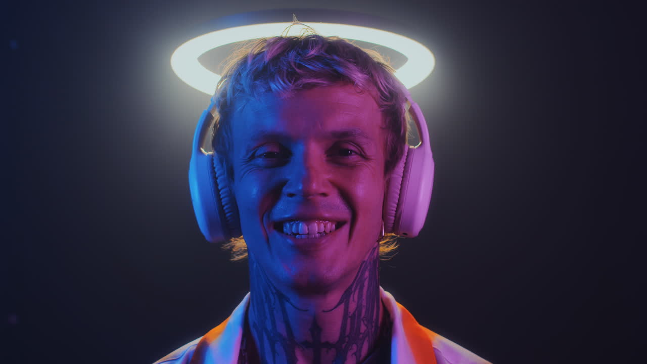 Portrait of Smiling Young Guy under Ring Light