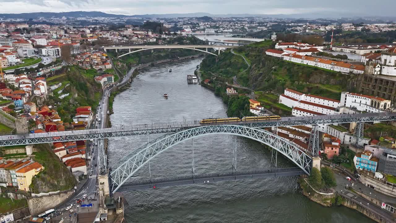 Aerial hyperlapse of Porto with bridge Ponte Louis I and moving clouds