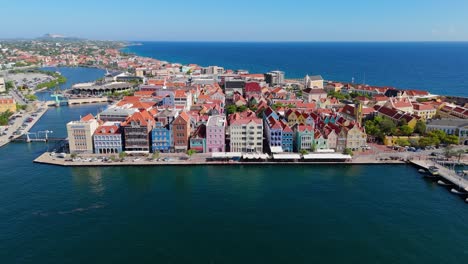 Panoramic-aerial-establishing-view-of-Handelskade-Punda-District-Willemstad-Curacao-at-midday