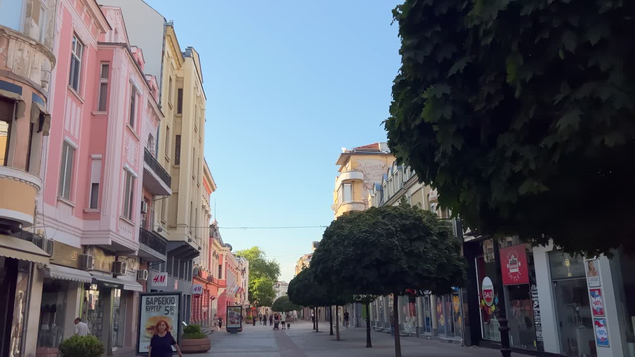 Walking POV of the beautiful buildings on the main pedestrian street. Many houses along Main Street today are cultural monuments, built at the beginning of the 20th century. Looking up.