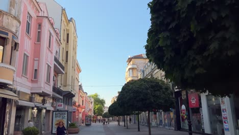 walking pov of the beautiful buildings on the main pedestrian street. many houses along main street today are cultural monuments, built at the beginning of the 20th century. looking up.
