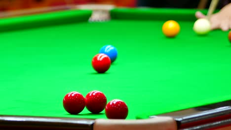 close up of snooker shooting on snooker table. game of snooker.