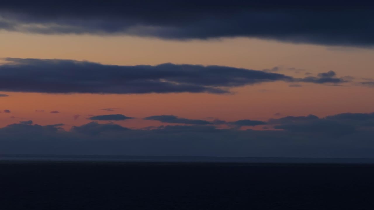 Drone tracks seagulls soaring over the Atlantic oceans at twilight. Keflavik, Iceland