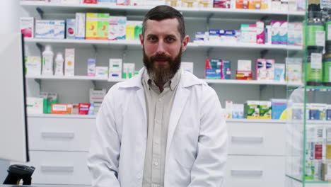 man posing behind the counter