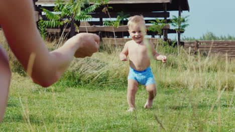 The-First-Steps-Of-The-Baby-The-Boy-Of-1-Year-Uncertainly-Goes-To-Mum-Slow-Motion-Video