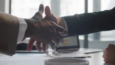 Close-Up-of-Handshake-of-Two-Multiethnic-Businessmen