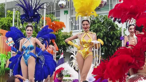 colorful parade with showgirls in thailand