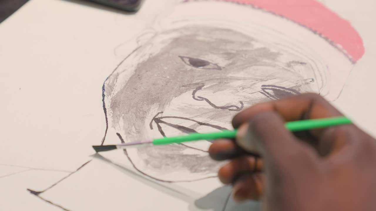Closeup finishing strokes on black painting portrait, artist adding highlights to lips and cheek, green brush gliding near pink hat accent, lively expression revealed, energetic studio atmosphere