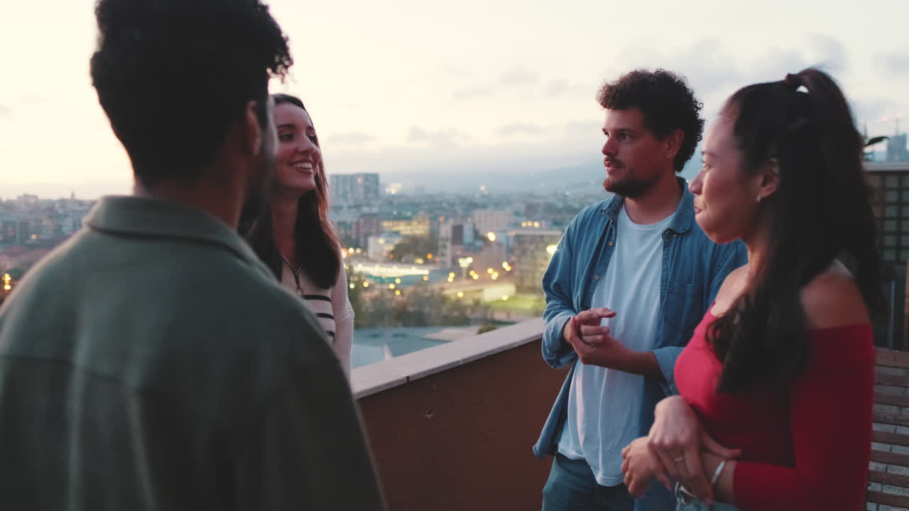 Group of friends socializing on a rooftop terrace