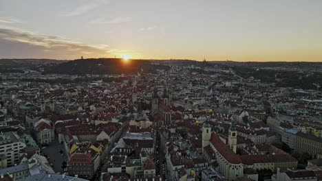 prague czechia aerial v64 drone flyover old town capturing cityscape of historical districts, narrow streets and vltava river with sunset on the horizon - shot with mavic 3 cine - november 2022