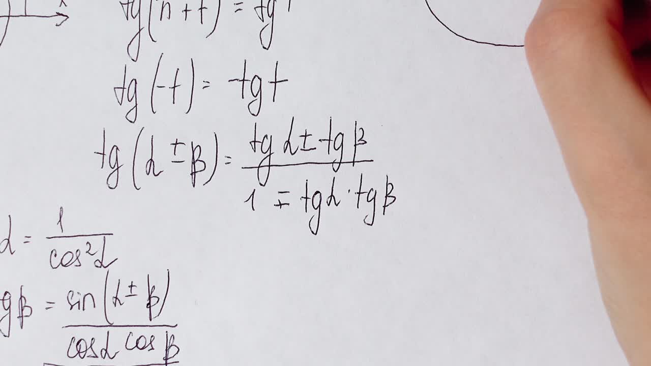 Writing of mathematical formulas on paper. Work of the mathematician