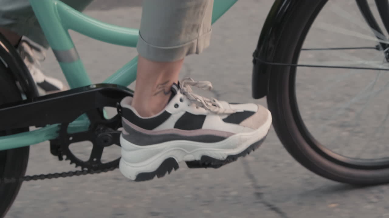 Unrecognizable Legs Riding Bike Outdoors