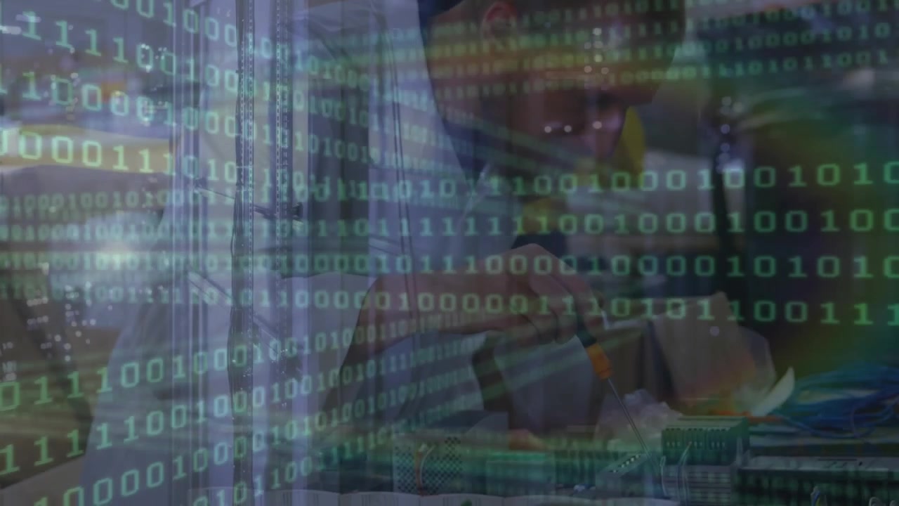 Animation of binary coding and data processing over caucasian male engineer working at factory