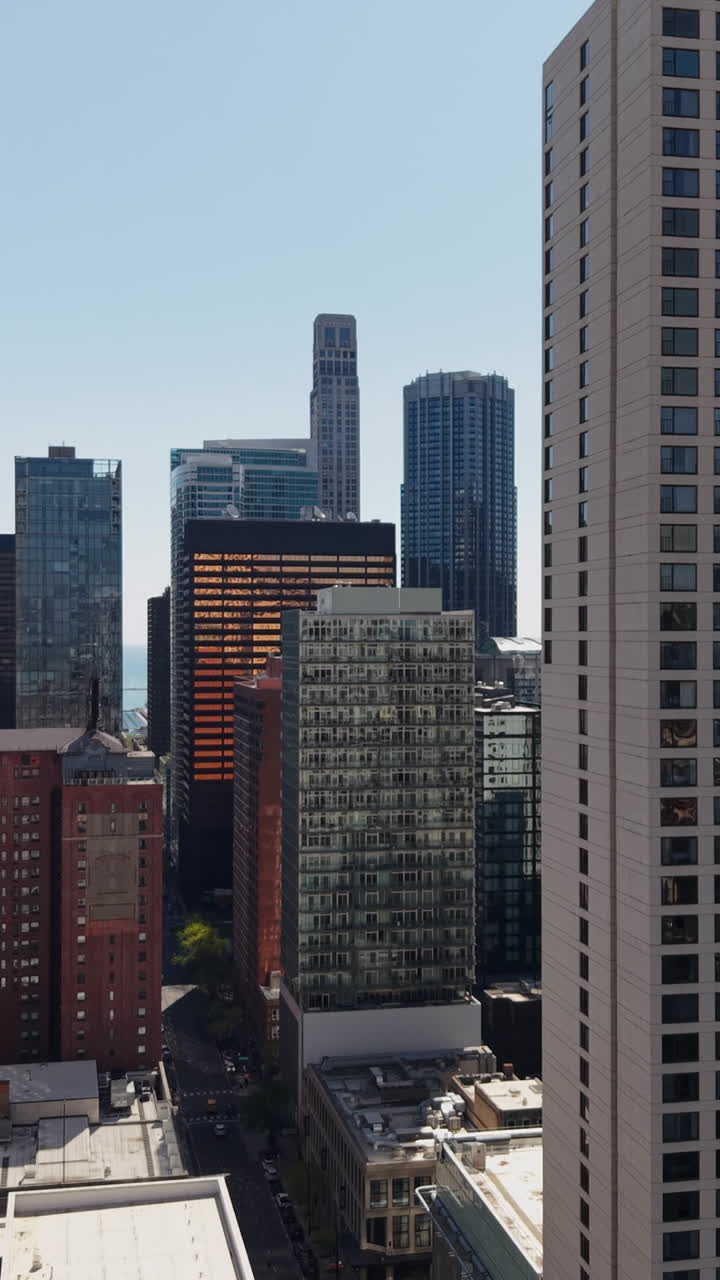 Chicago USA, Vertical Drone Shot of Downtown Towers and Skyscrapers in Sunny Day