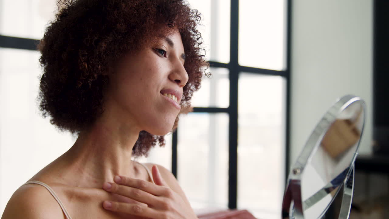 Woman looking in the mirror