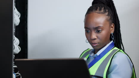 Laptop,-network-or-black-woman-in-server-room