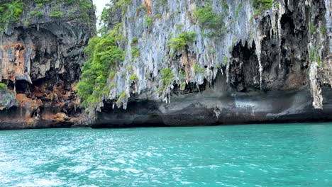 limestone cliffs above vibrant turquoise sea