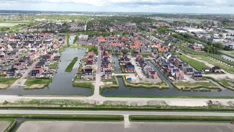 aerial footage of new modern residential area, freestanding housing, the netherlands, green, peacefull housing.