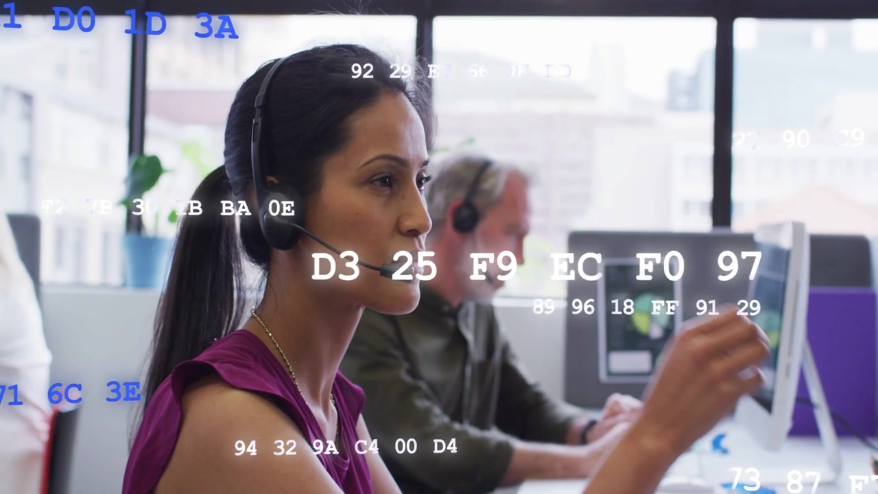 Woman taking incoming support call speaking and adjusting headset while blue code overlay scrolling