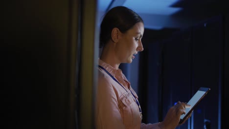 Caucasian-female-it-technician-using-tablet-checking-computer-server