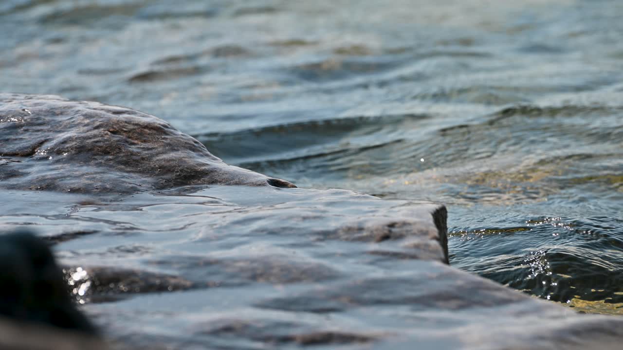 Lake Huron water washing up on rocks erosion