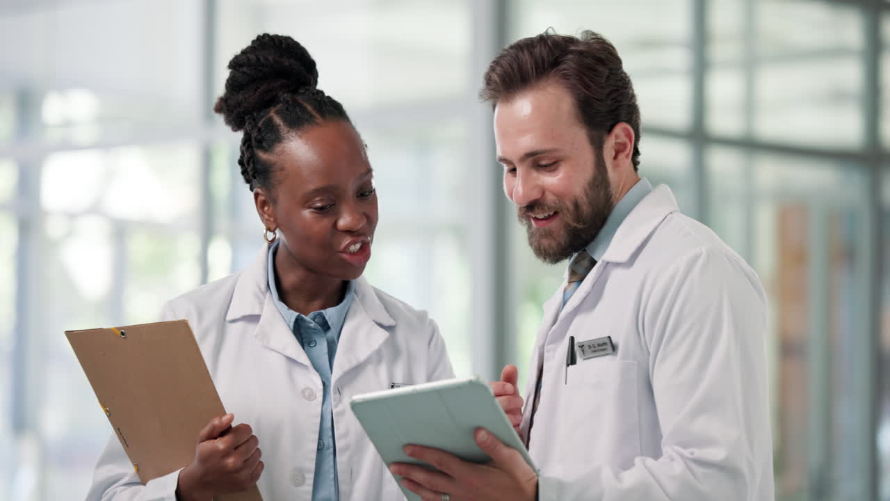 Two Doctors Discussing Medical Information on a Digital Tablet