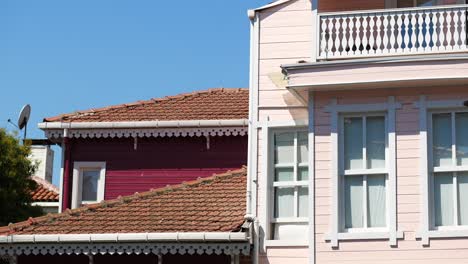 pink and red wooden houses in a sunny day