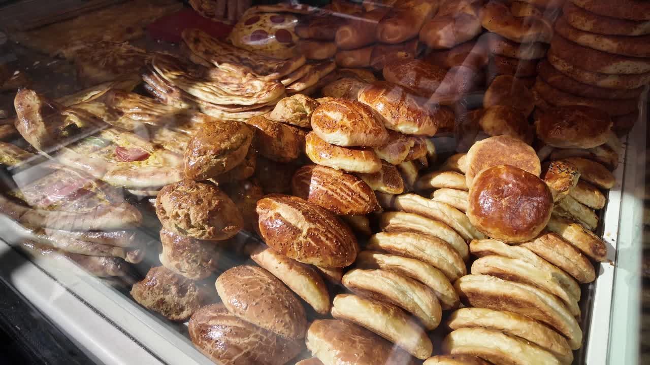 Variety of Turkish Breads and Pastries in a Bakery Display