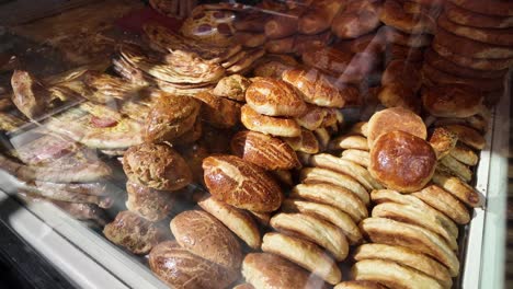 variety of turkish breads and pastries in a bakery display