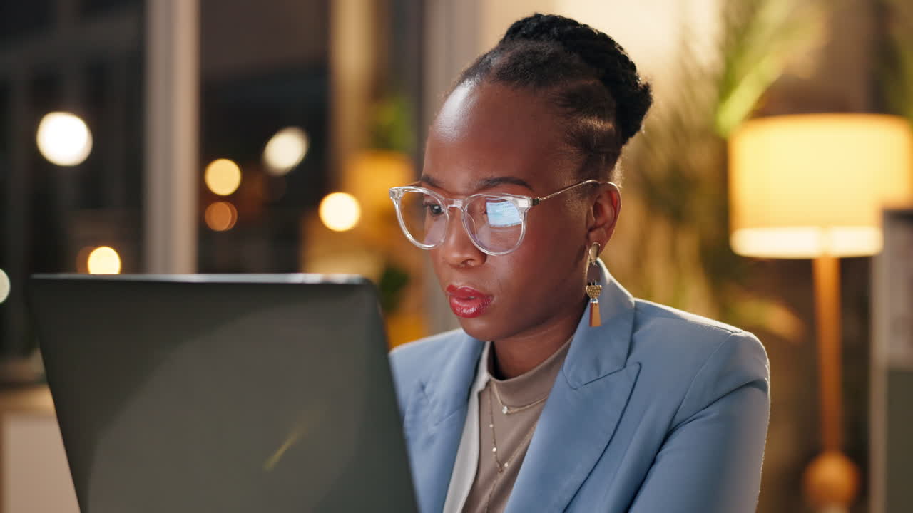 Focused businesswoman working late at night