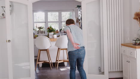 Young-Downs-Syndrome-Man-Having-Fun-Dancing-At-Home