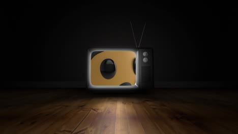 crying face emoji on television screen over wooden surface against black background