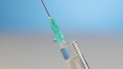 close-up medical syringe, let the air out, concept of vaccination or illness